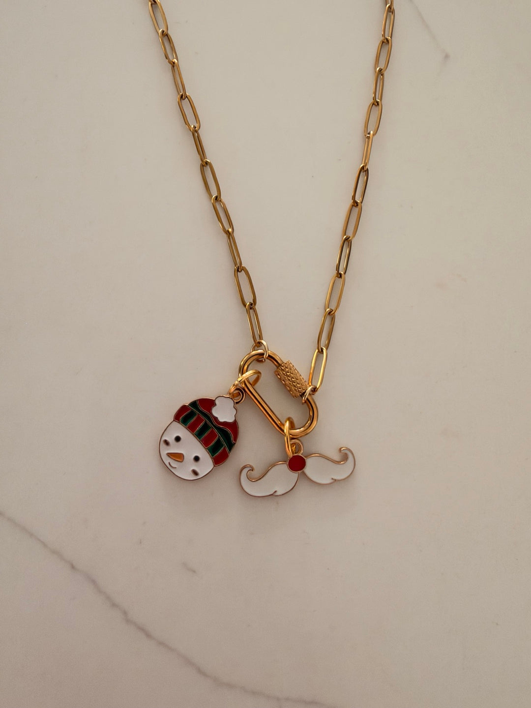 Gold-tone paperclip necklace with snowman and white mustache Christmas charms